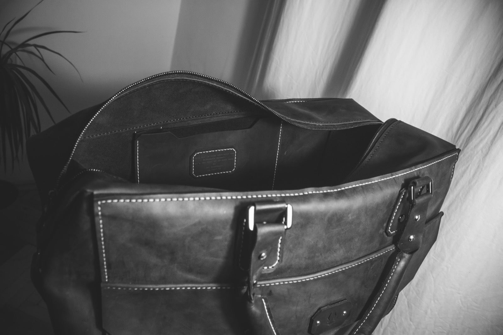 The bag open, showing the interior and personalised patch
